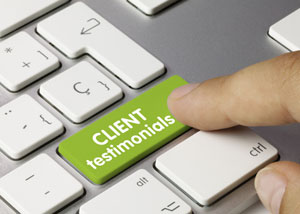 finger pressing a keyboard with the words client testimonials